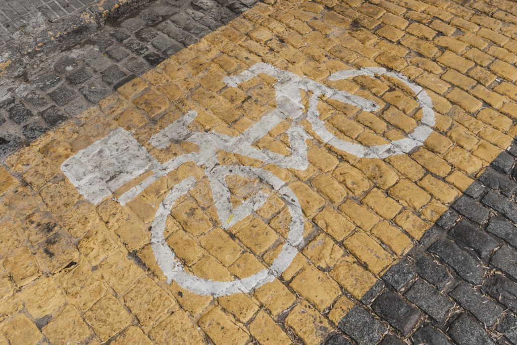 high-angle-road-sign-with-bicycle